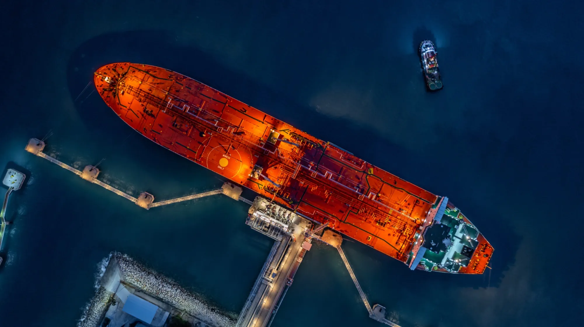 An oil tanker berthed at a terminal, seen from above